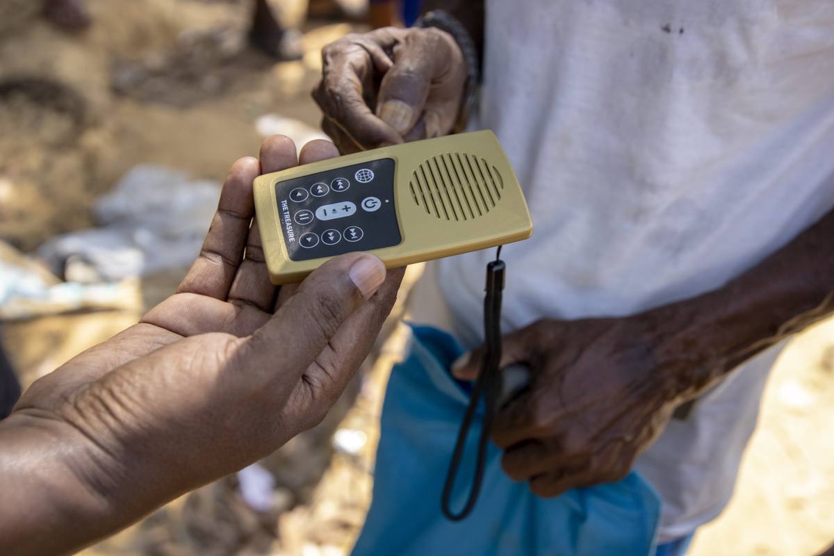 Hands holding a Treasure, an audio Bible device